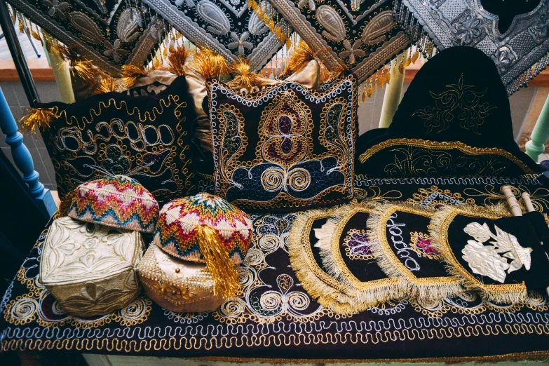 ornately decorated table with colorful pieces of fabric