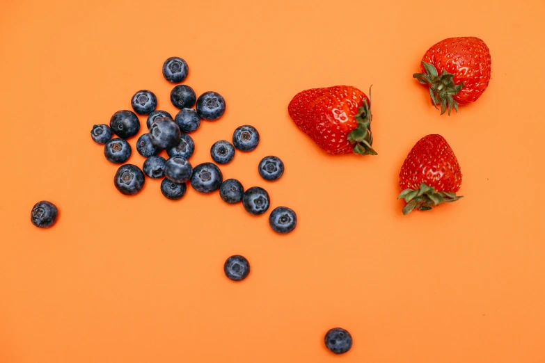 fruits are sitting together in a row on the table