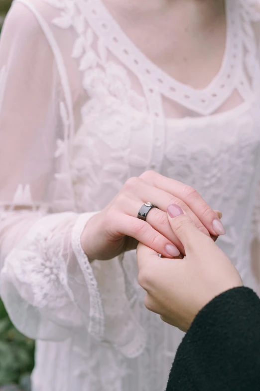 woman is holding the hand of another woman who is holding the other hand