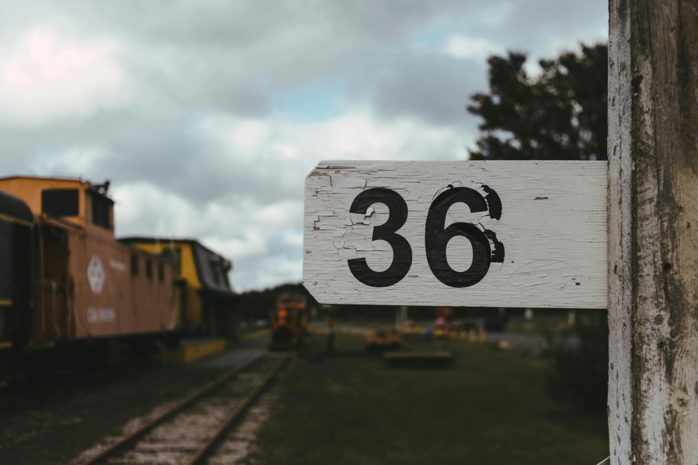 train numbers sign posted on the outside of a building