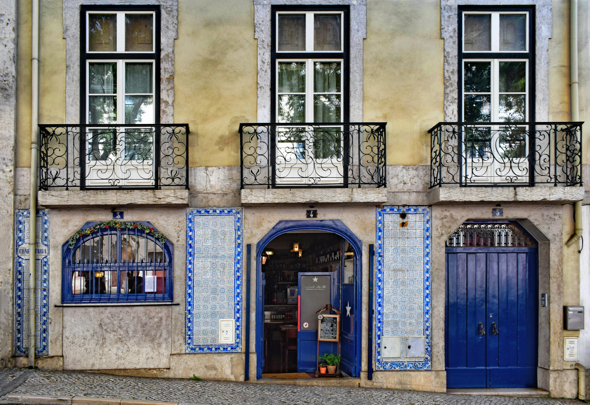 the front door to a building with glass windows