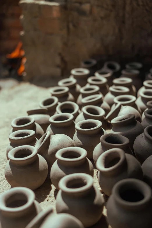 pottery pots sitting on top of cement blocks