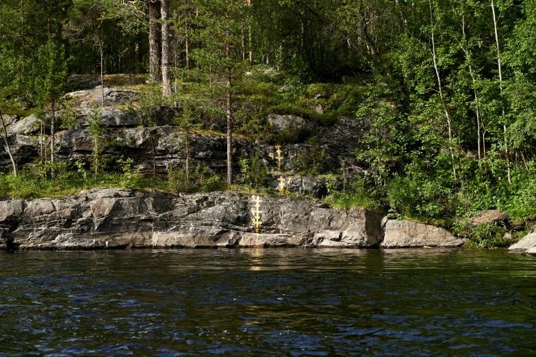 an empty bench sits on the edge of the water