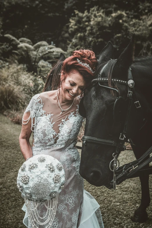 the bride and her horse pose for the camera