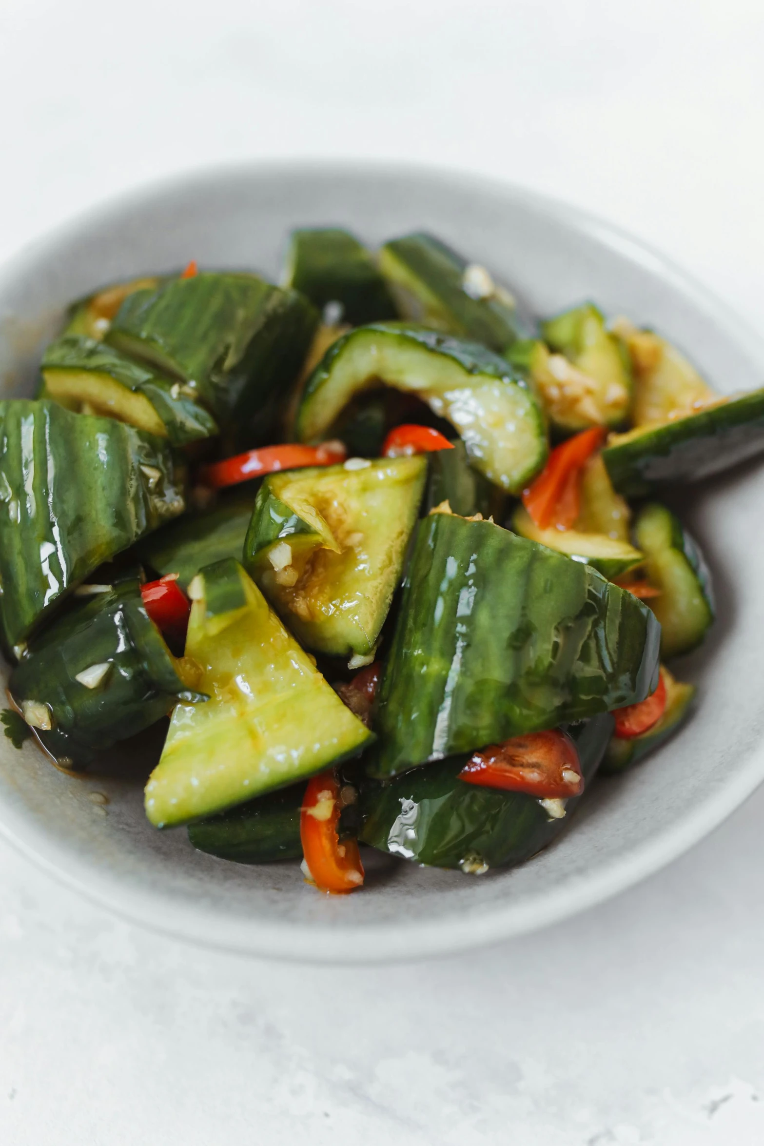 a close up of a bowl of food with vegetables