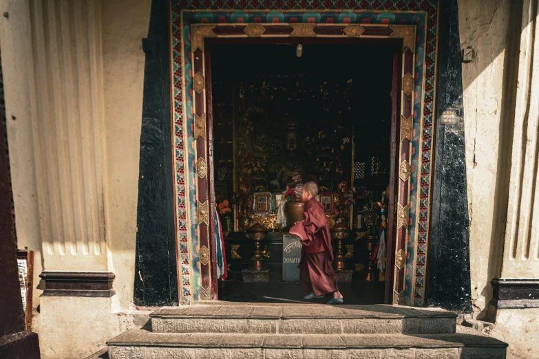 an older person walking through a door way