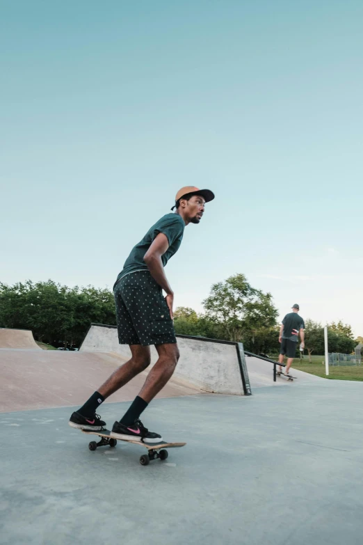 young man riding on skate board in the park
