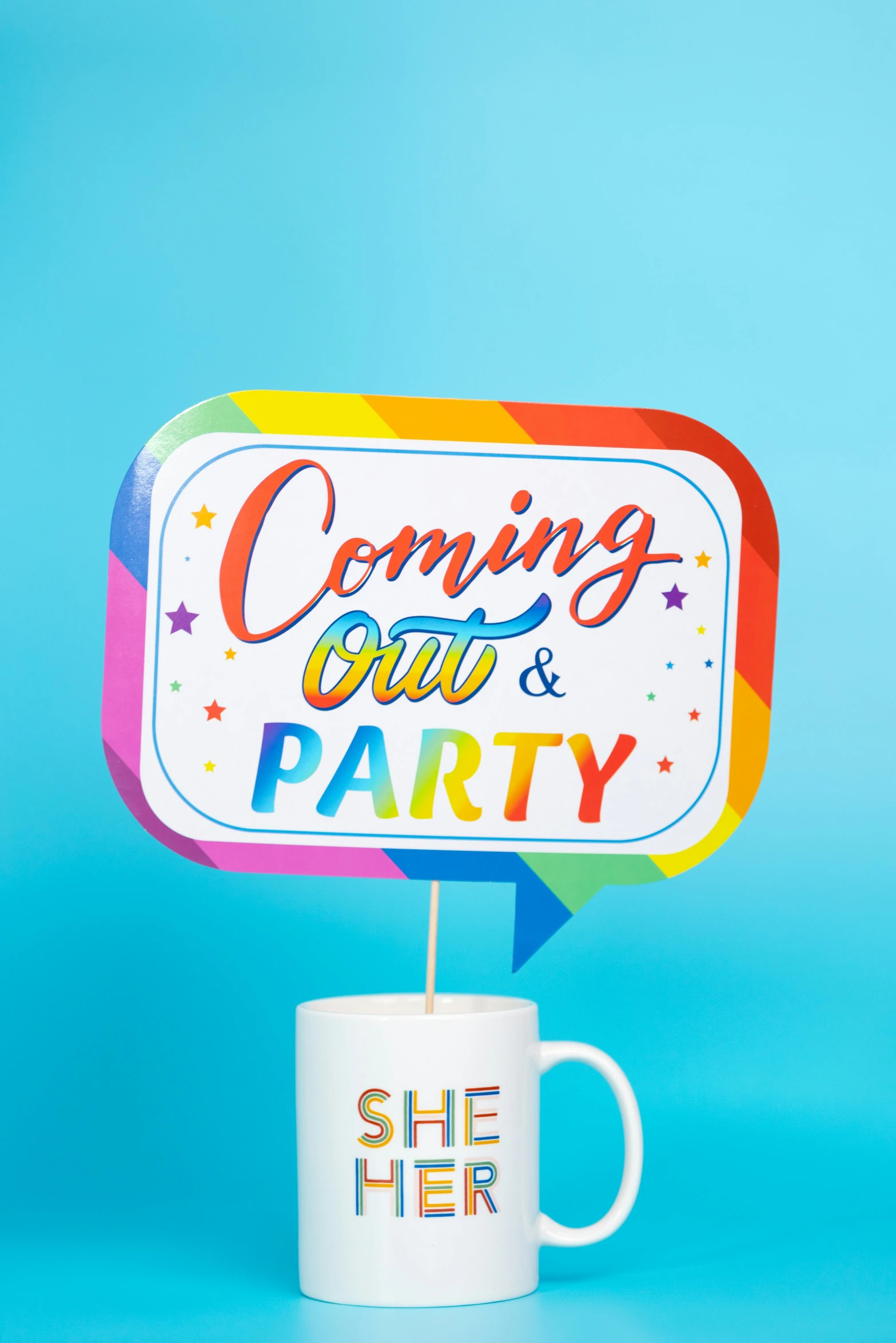 a mug and sign with the words coming out & party on it