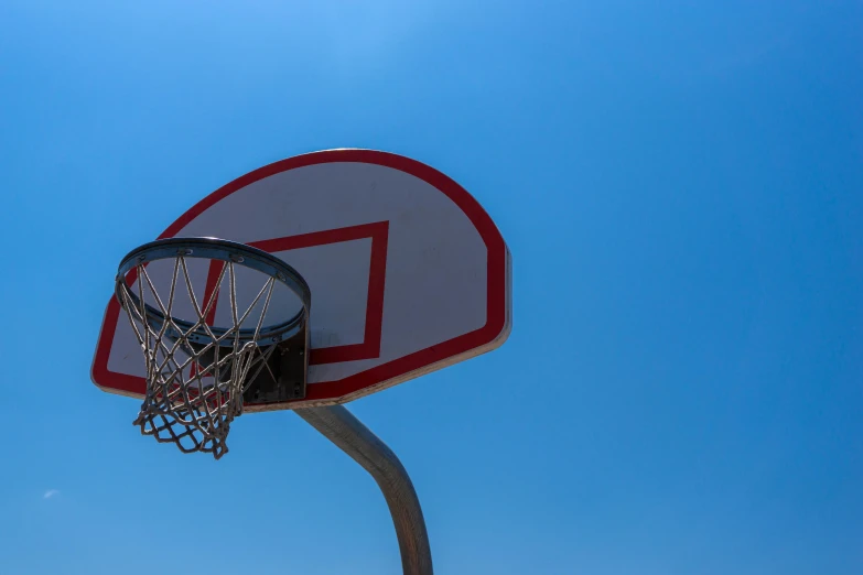 there is a basketball going in the hoop for the hoop