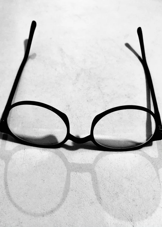 a pair of glasses with the lens reflected off