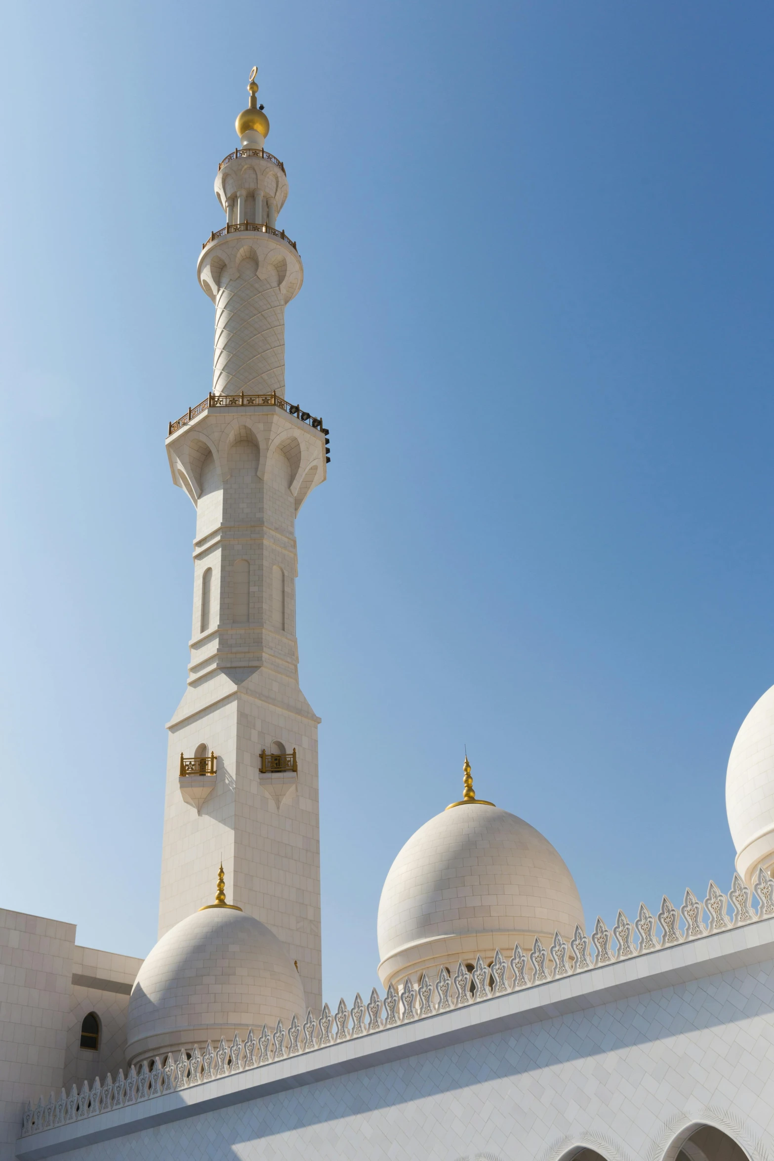 a large white building with a gold decoration on it