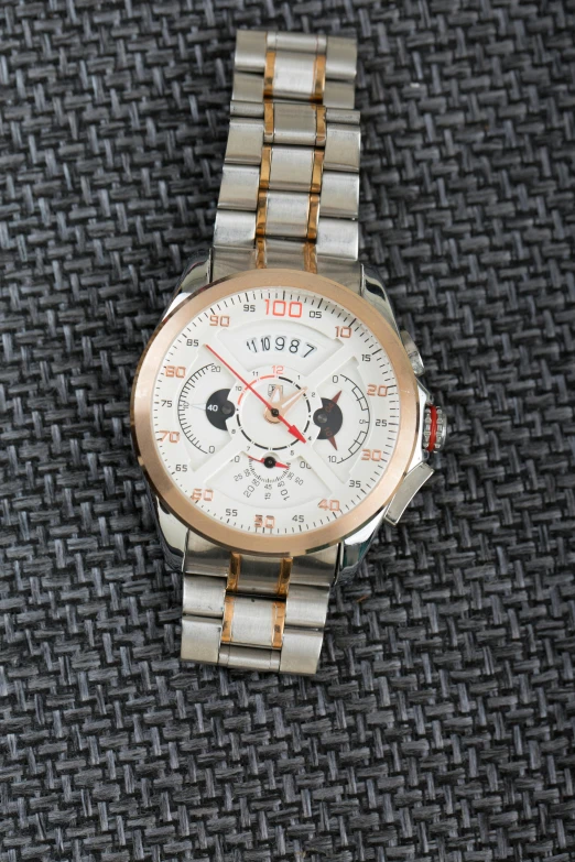 a watch sitting on the ground in a closeup s