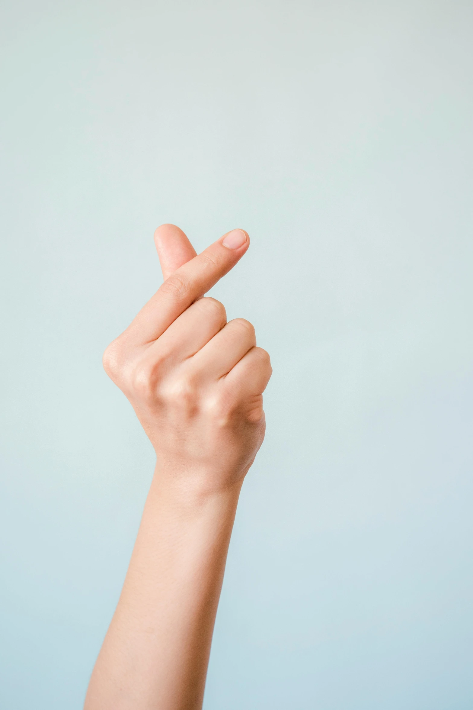 a close up of a person's hand holding an object