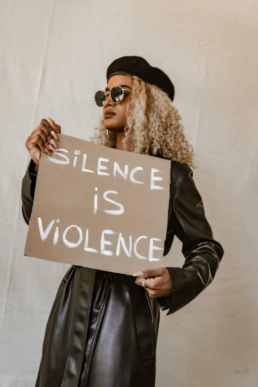 woman with sign saying science is violence