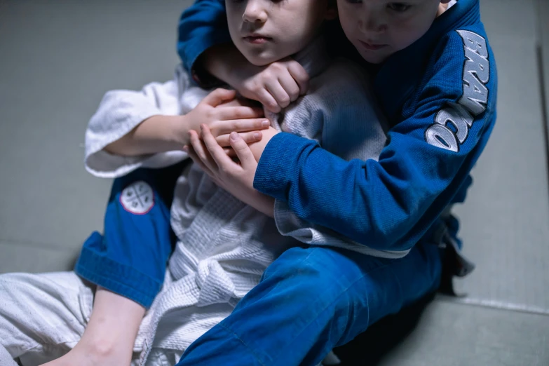 two s playing in karate outfits