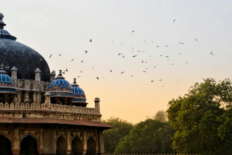 a blue domed building with two massive domes