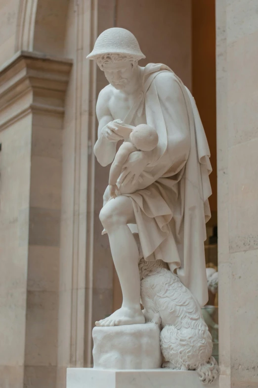 a marble statue with a hat on top of it