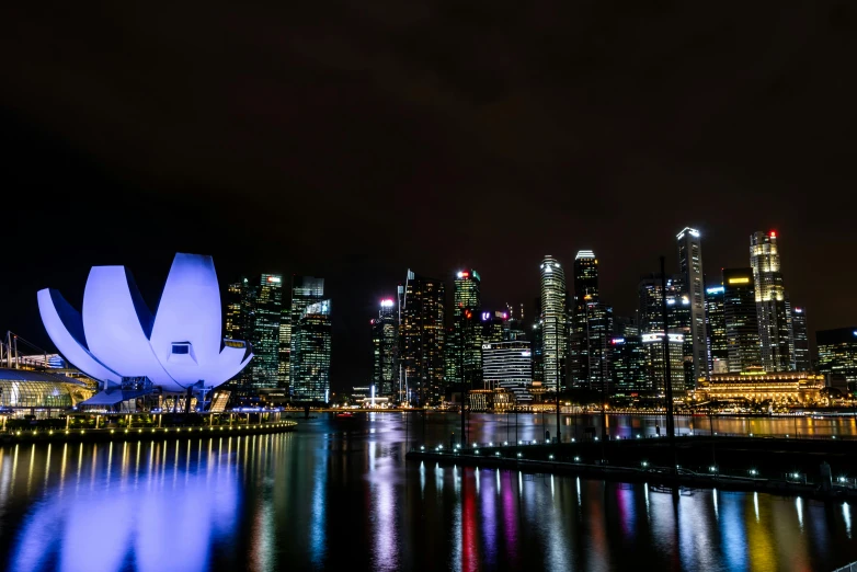 a night scene with city lights reflecting on water