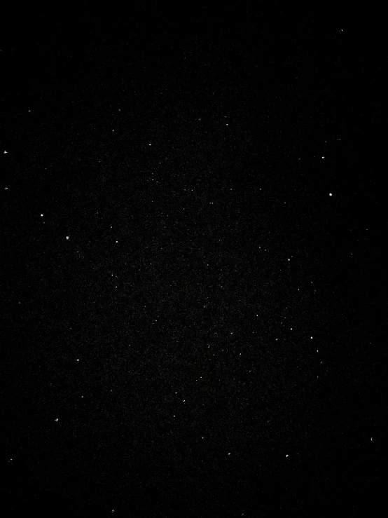 black background with lots of tiny stars and no image