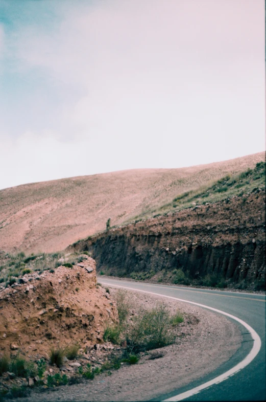 a road that has a big curved bend in the side