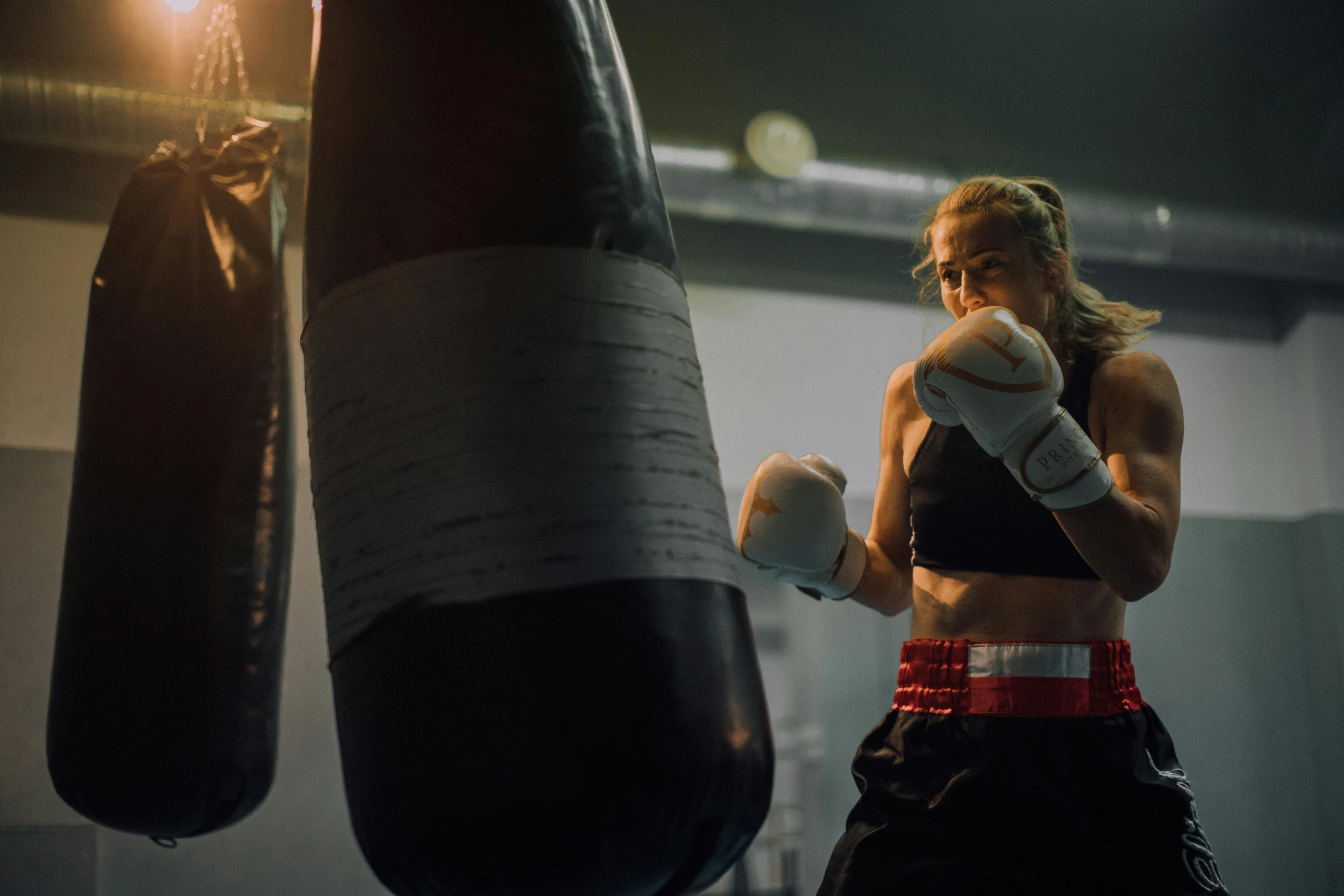 a young woman getting ready to work out on her boxing gloves