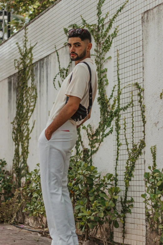 a man with a backpack and white shirt