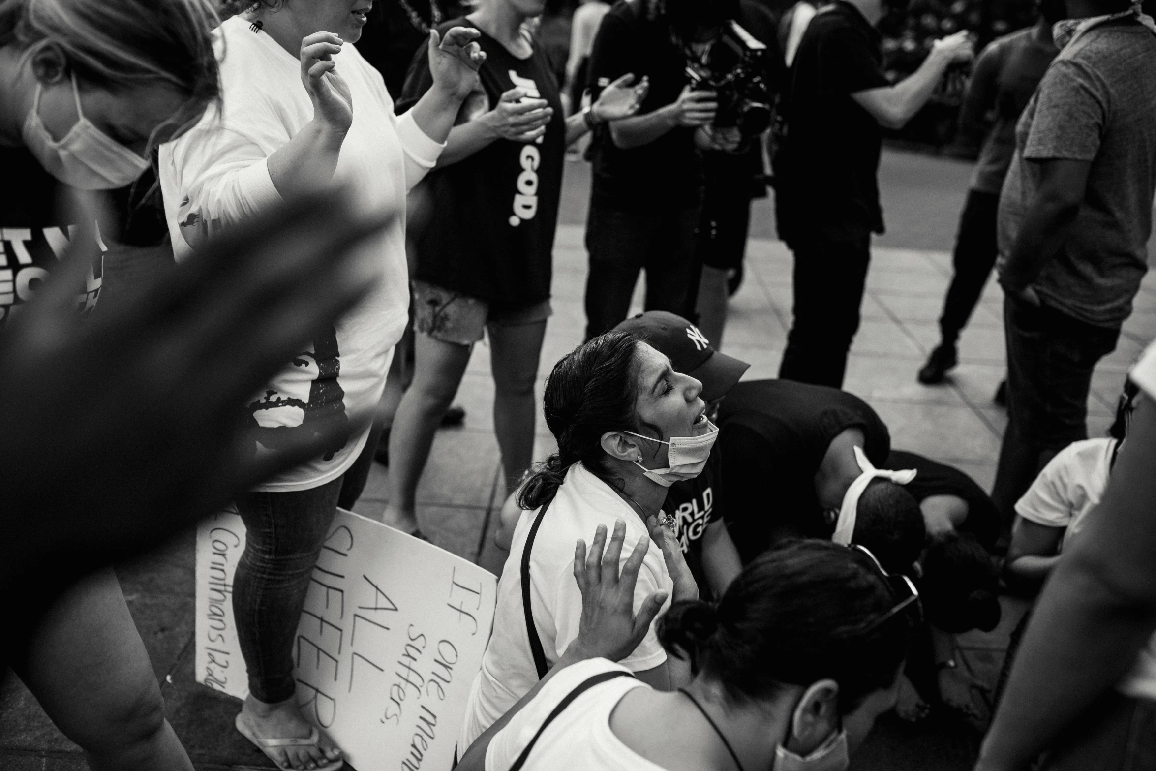 many people are standing around with masks on their faces