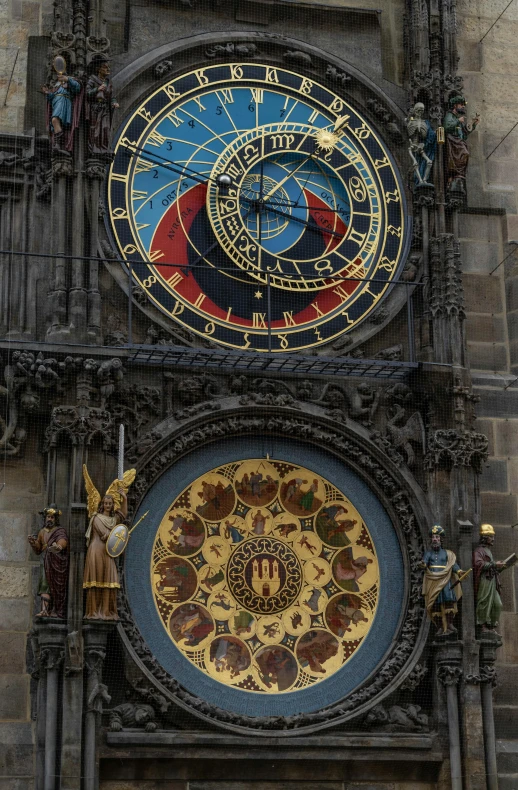 two massive clocks that are on the sides of a building