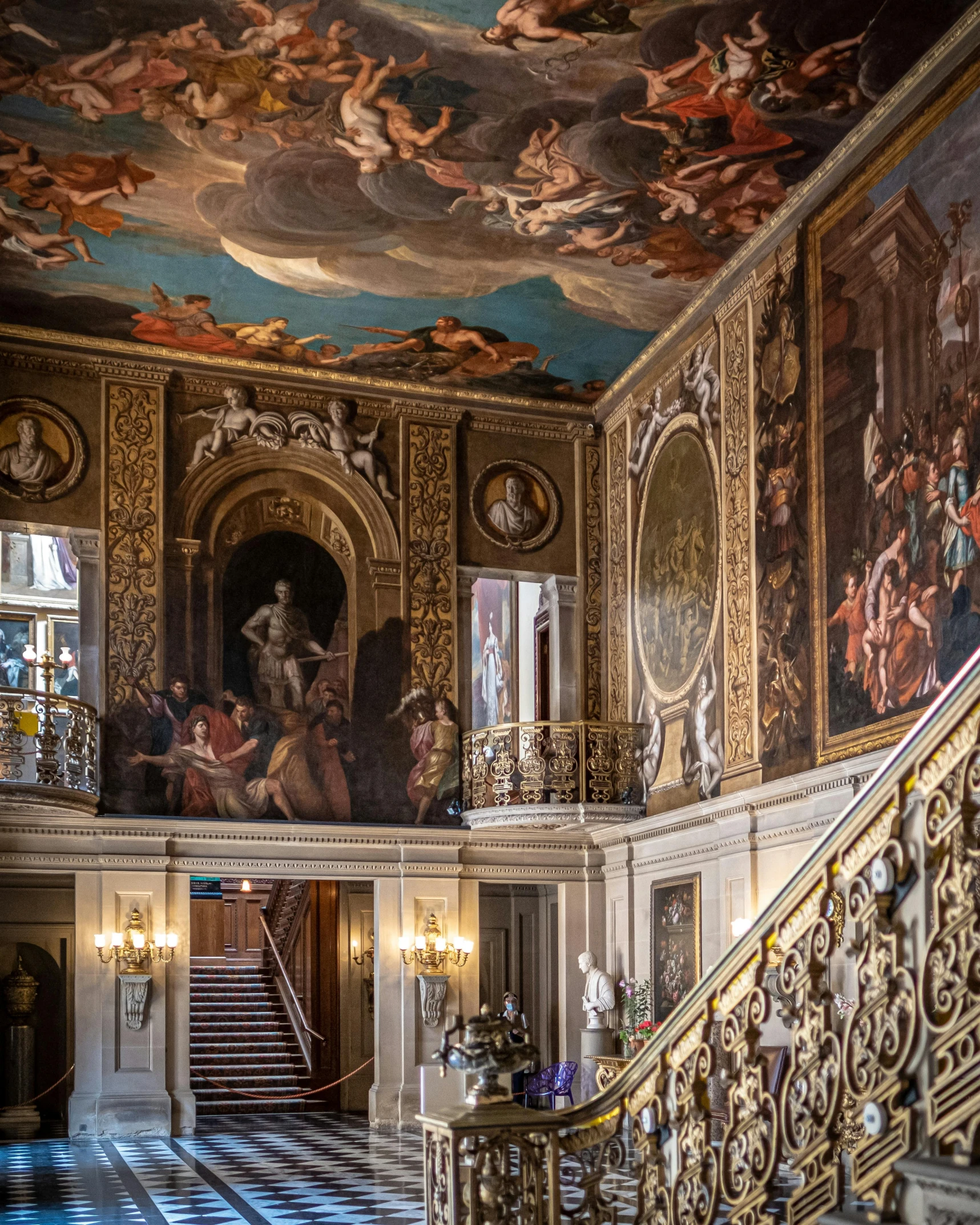 ornate painted staircases and beautiful ceiling in a large room