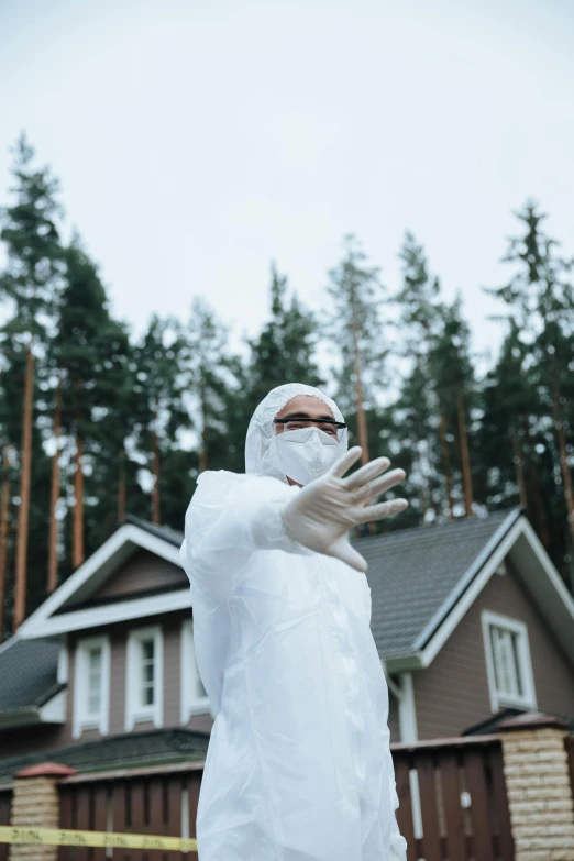 a man in a white robe with a frisbee