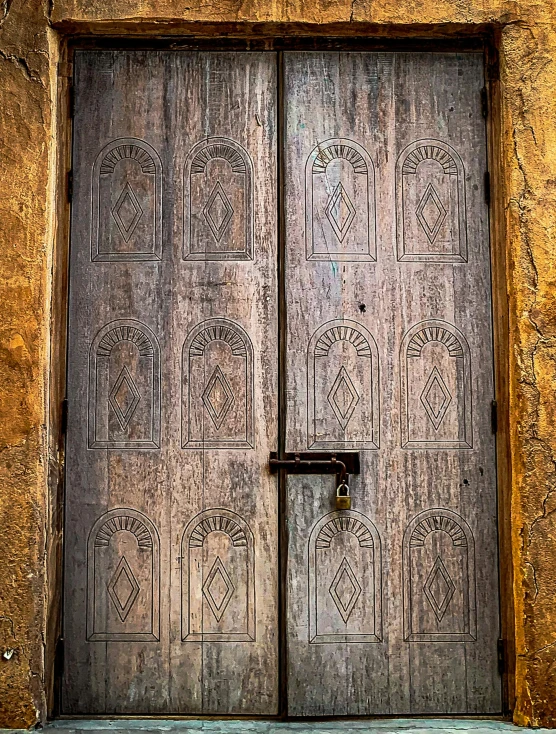 an ancient door in the side of an old building