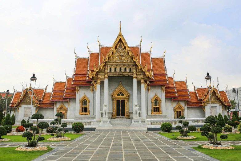 the very ornate building is sitting on bricks