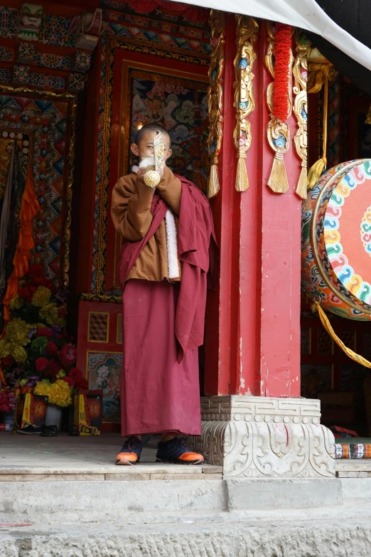 a monk standing on a building in china