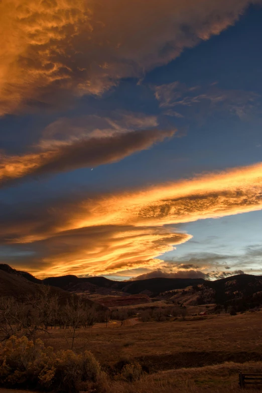 a scenic po of an arid plain with clouds in the sky