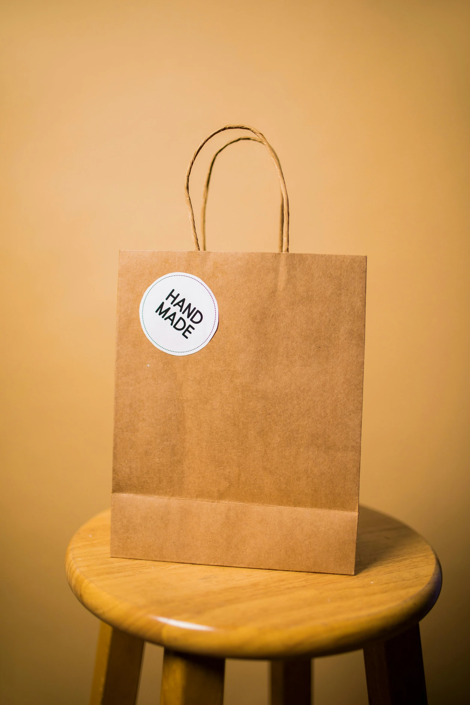 a bag on a stool with a sticker