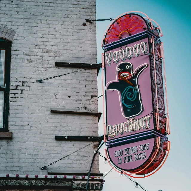 the neon sign on the building is colorful