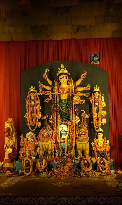 an image of a ganesha sculpture displayed for worship