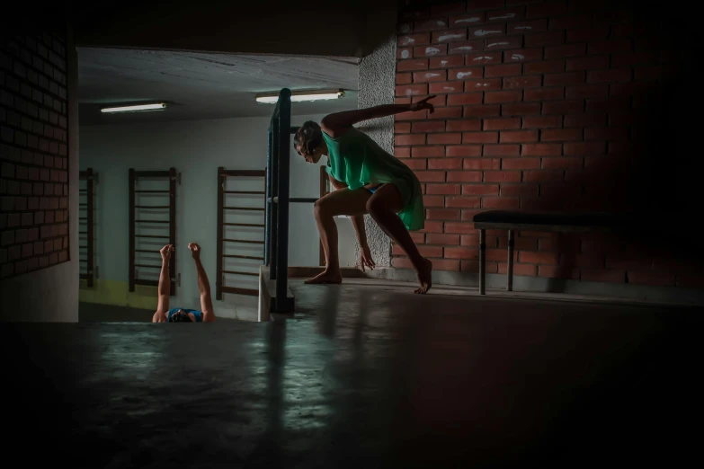 two people are in the dark by a pole