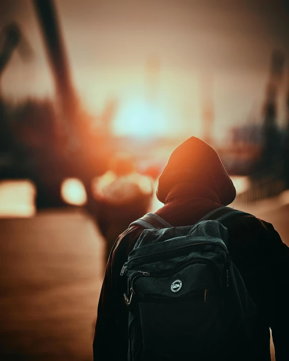 a person walking down the street while wearing a backpack