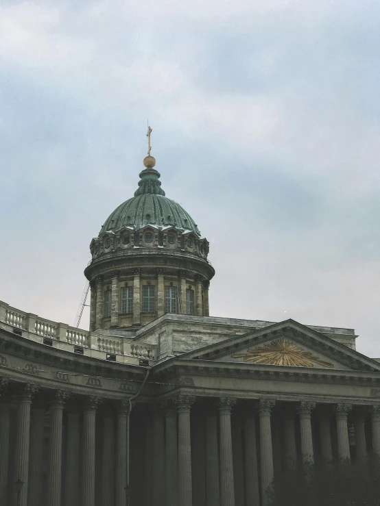 the dome of a building with pillars surrounding it