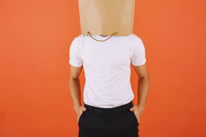 a person standing with a bag on his head