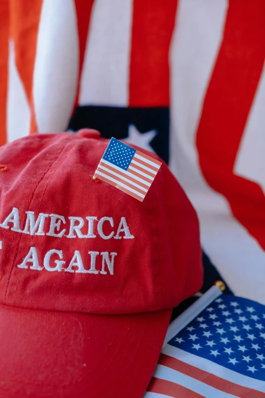 a red cap with american flag in the background