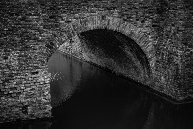 a stone bridge with water in it