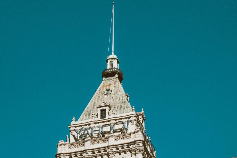 the top of the tall clock tower is blue