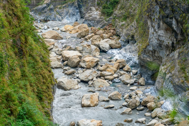 a very pretty river that is running under some rocks