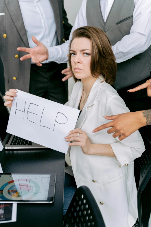 two people with signs standing in front of them