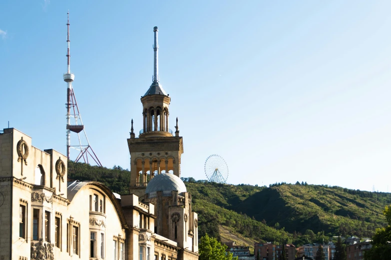 a very tall tower with a wind indicator on it