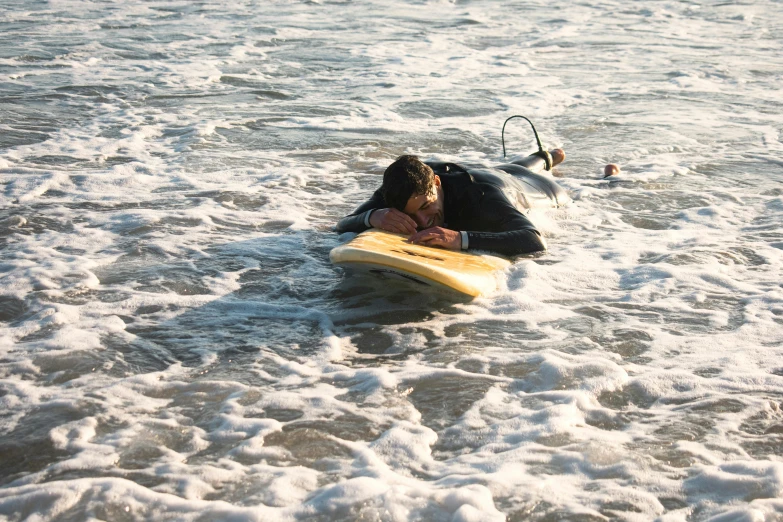 a couple kissing while riding on top of a wave