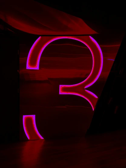 the letters q are neon purple and red