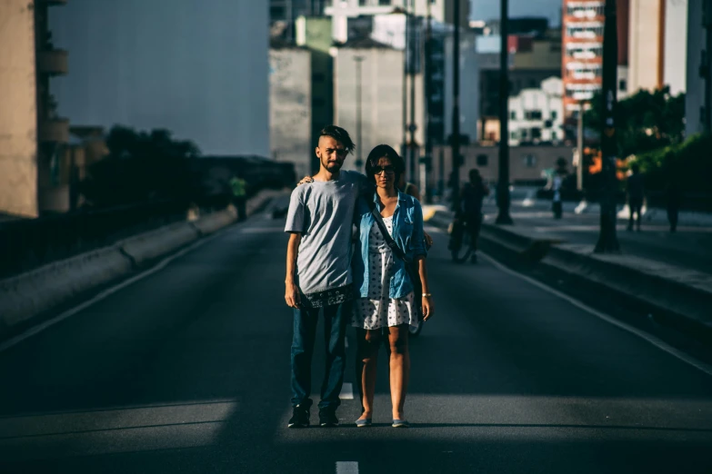 young couple standing on a street in the city